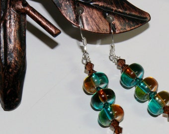 Ladies handmade dangle earrings with glass brown/teal disc and Swarovski bicone crystals with sterling silver earwires