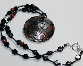 Round Lampworked Glass Black/Silver/Copper Pendant on Black Beaded Handmade Necklace