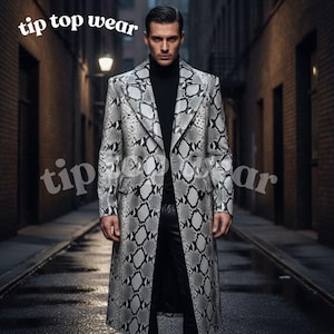 May include: A long coat with a snakeskin pattern in grey and white. The coat has a classic lapel and a tailored fit. The text "tip top wear" is visible in the image.