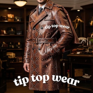 May include: A brown snakeskin-patterned trench coat with a belt and double-breasted closure. The coat has a cape-like detail on the back and the text "tip top wear" is displayed in white.