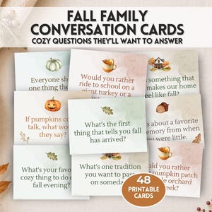 May include: A set of 48 printable fall family conversation cards featuring watercolor illustrations of pumpkins, acorns, and autumn leaves. Each card displays a unique question with text such as What is the first thing that tells you fall has arrived? The cards are arranged in a grid with a soft, muted color palette.