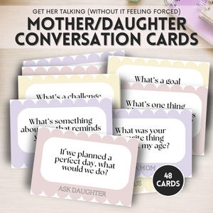May include: A set of 48 mother/daughter conversation cards with scalloped edges in pastel shades of pink, yellow, and purple. The cards feature black text with prompts like 'What's a goal', 'What's a challenge', and 'If we planned a perfect day, what would we do?'