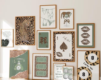 May include: A collection of framed art prints with a leopard print theme. The prints feature various designs, including a leopard, playing cards, lips, and text. The color palette includes brown, green, and white.