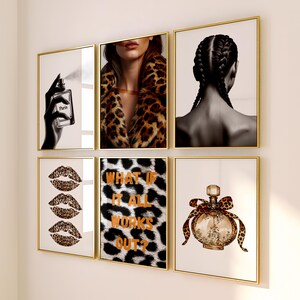 May include: Six framed art prints with gold frames. The prints feature images of perfume, lips, a woman in a leopard print coat, and a woman's braided hair. One print has the text "WHAT IF IT ALL WORKS OUT?"