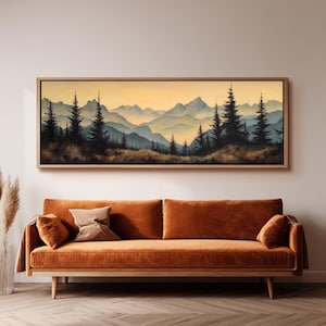 May include: A panoramic landscape painting in a wooden frame featuring dark silhouettes of pine trees against a backdrop of layered blue mountains and a soft golden sky, displayed above a long, solid orange velvet sofa with two matching cushions.