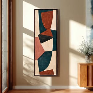 May include: A tall, rectangular framed wall art piece featuring an abstract composition of geometric shapes in shades of deep teal, terracotta, black, and cream. The design consists of overlapping curved and angular forms.