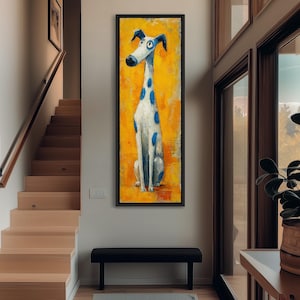 May include: A framed vertical painting of a whimsical dog with a long neck, white body, and blue spots. The dog sits against a bright yellow background. The artwork is displayed in a modern home setting.