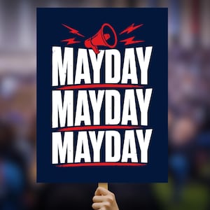 May include: A navy blue sign with the word "MAYDAY" in large white letters stacked three times, with red lines and a megaphone graphic. The sign is held up by a hand, with a blurred background.