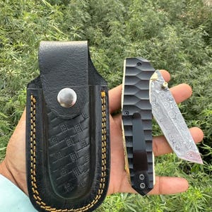 Handmade damascus folding knife with micarta handle