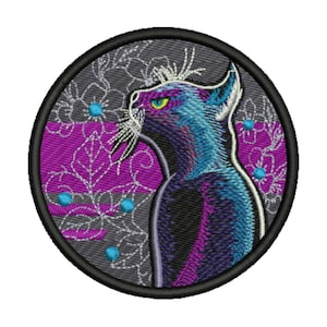 May include: Embroidered patch featuring a stylized cat profile in shades of blue and purple, set against a backdrop of gray and purple floral patterns. The cat has yellow eyes and white whiskers, surrounded by a black circular border.