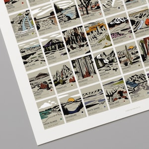 May include: A print featuring illustrations of various national parks and landmarks. Each image is in a rectangular frame with the park name and location below. The artwork includes images of the Grand Canyon, Yellowstone, and Joshua Tree.
