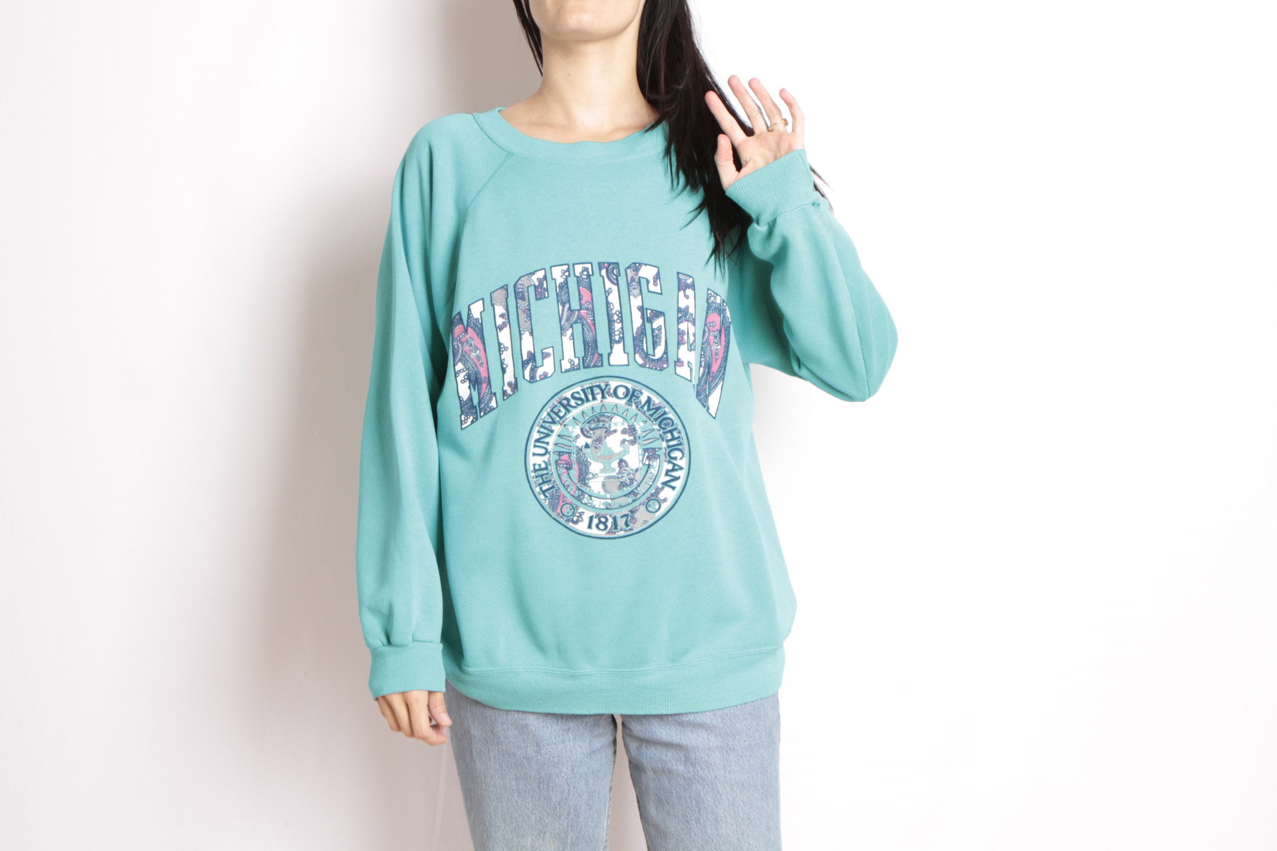 90s University of Michigan football teal blue vintage 1990s sweatshirt pullover raglan top 90s University of Michigan football teal blue pullover vintage 1990s sweatshirt pullover blue raglan top 814666
