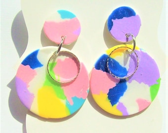 Rainbow polymer clay dangle earrings in soft pastel colors round design 2" long 1" wide hand crafted pinks blues purples yellow on white