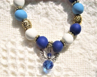 Angel Guardian Bracelet royal blue stretch polymer clay beaded bracelet powder blue & white and tiny silver angel with royal blue crystal