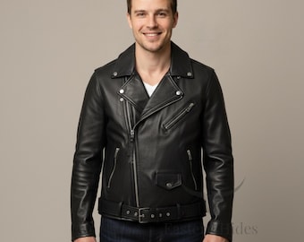 May include: Black leather motorcycle jacket with a notched collar, asymmetrical zipper closure, and multiple zippered pockets. The jacket features a belt at the waist and is worn with blue jeans. The model is smiling.
