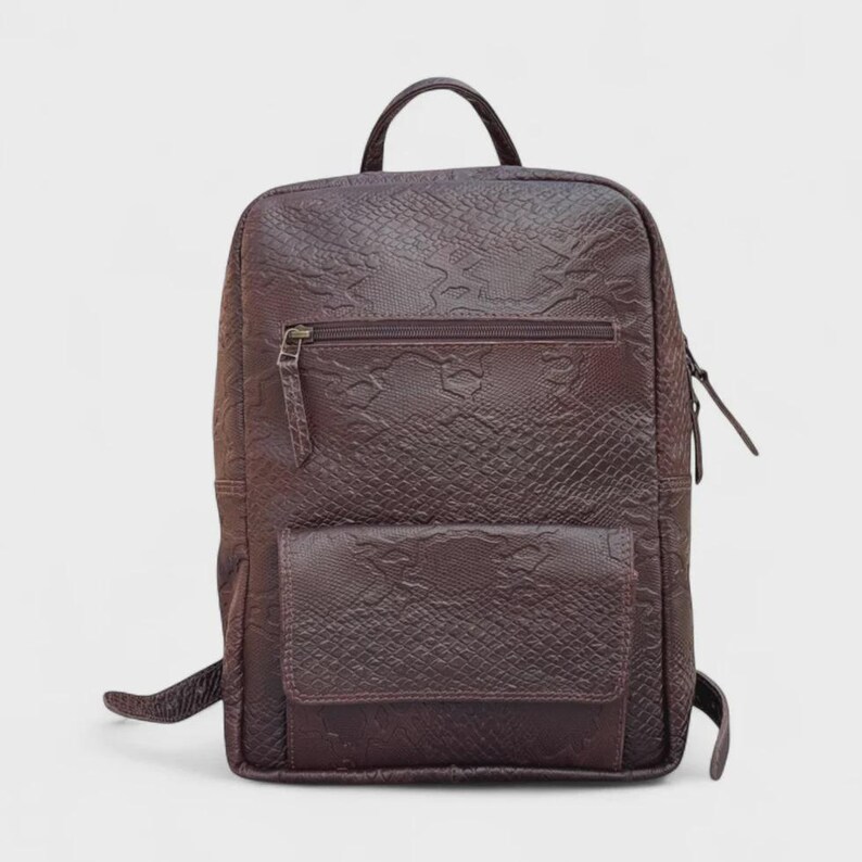 Front View: "Front view of the Python Anaconda Texture Leather Backpack, showcasing the luxurious python-embossed leather and premium Italian brass hardware.