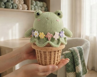 Frosch-Strickmuster (PDF), Plüschtier im Blumentopf mit pastellfarbenen Blumen
