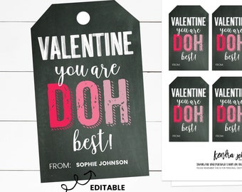 May include: Four printable Valentine's Day gift tags with a chalkboard background. The tags feature the text "Valentine you are DOH best!" in pink and red letters. The text "FROM:" is followed by a blank space for personalisation. The tags are editable.