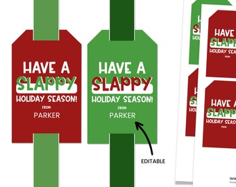 Könnte beinhalten: Zwei druckbare Geschenkanhänger in Rot und Grün. Die Anhänger zeigen den Text "Have a Slappy Holiday Season!" mit der Möglichkeit, einen Namen hinzuzufügen. Der Text "Editable" steht unter den Anhängern.