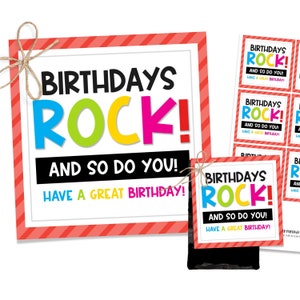May include: A set of four printable birthday cards with a red and white striped background. The cards feature the text "Birthdays Rock! And so do you! Have a great birthday!" in black, white, and rainbow colors.