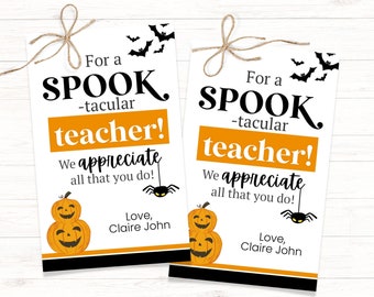 May include: Two printable gift tags with a Halloween theme. The tags feature a black and orange color scheme with the text "For a Spook-tacular Teacher! We appreciate all that you do!" and a stack of three orange pumpkins with black faces. The tags also feature a black spider with a red body and black legs.
