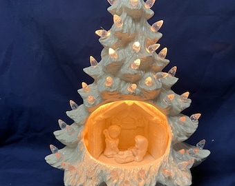 Nativity Tree. 13” tall white color, clear bulbs, clear star. Electrical included.