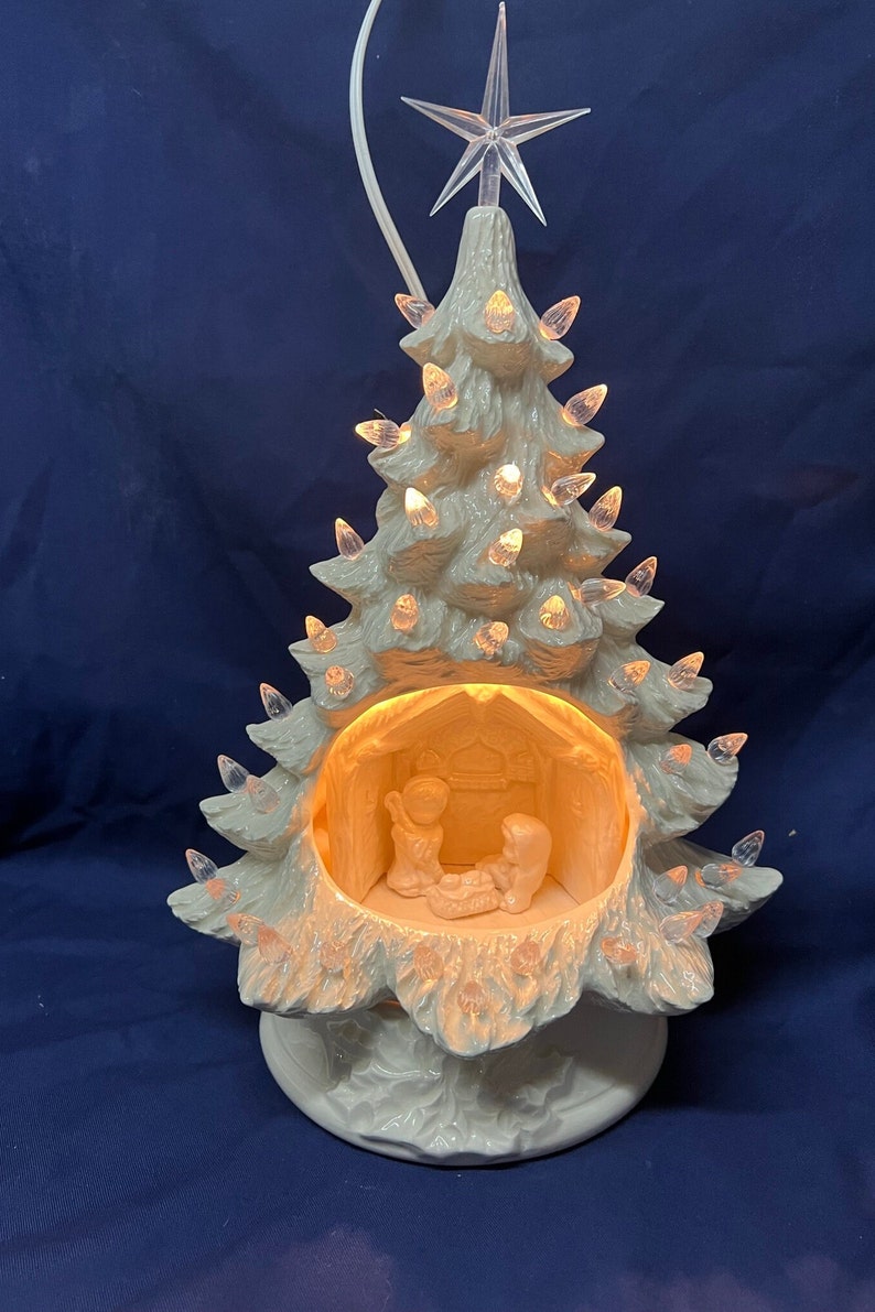 Nativity Tree. 13 tall white color, clear bulbs, clear star. Electrical included. image 1