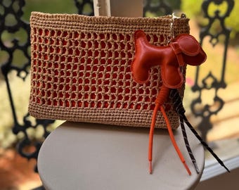Handwoven Raffia Crochet Clutch Bag: Boho Dog Charm - Zeyn.C London