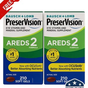 Pode incluir: Duas caixas de PreserVision AREDS 2, um suplemento vitamínico e mineral para os olhos. Cada caixa é verde e azul com o nome da marca e informações do produto. As caixas contêm 210 cápsulas gelatinosas e apresentam o texto "Recomendado por médicos".