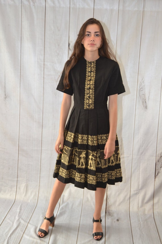 slim fit dress slacks Elegant Black Lace Knee-Length Dress with Gold Button Detail