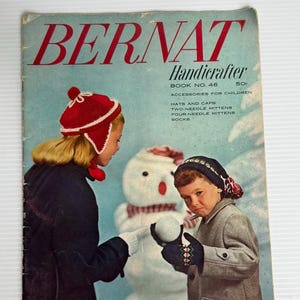 May include: Vintage Bernat Handicrafter Book No. 46 cover featuring children in winter attire. The cover displays the title in red, with a light blue background. The image shows a snowman and children wearing knitted hats and mittens.