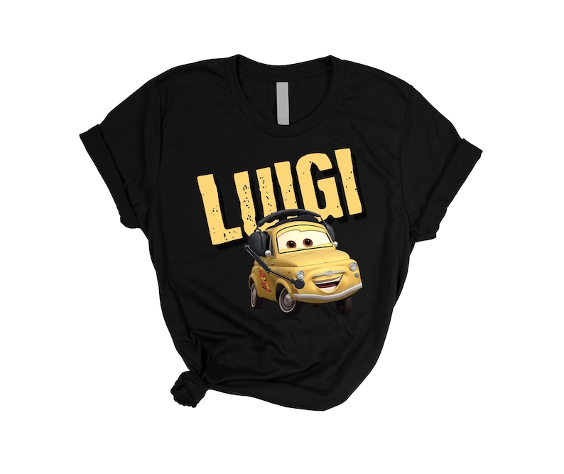 May include: Black t-shirt featuring the name "Luigi" in yellow block letters above a cartoon image of a yellow car with headphones. The car has a smiling face and is from the movie "Cars".