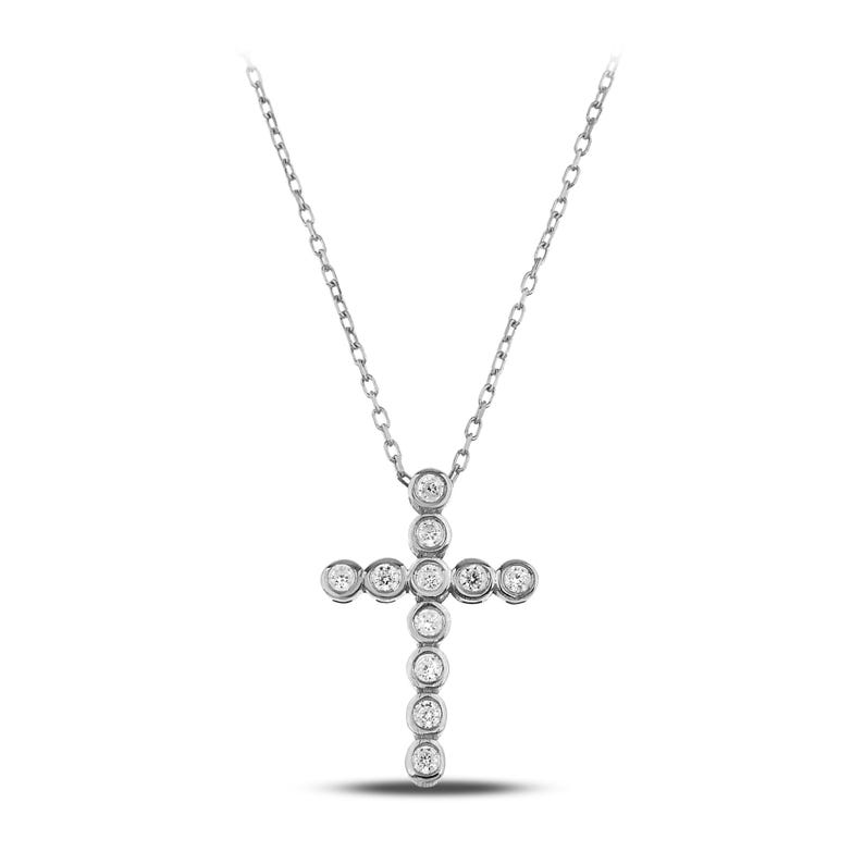 K&ouml;nnte beinhalten: Eine silberne Halskette mit einem Kreuzanh&auml;nger. Das Kreuz ist mit runden, klaren Edelsteinen verziert, die in einzelnen Fassungen gefasst sind. Die Kette ist zart und h&auml;ngt von der Oberseite des Kreuzes.