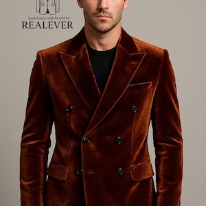 May include: A double-breasted, rust-colored velvet blazer with black buttons. The blazer has a classic notched lapel and two front pockets. The text "Look Iconic with REALEVER" and the brand name "REALEVER" are displayed.