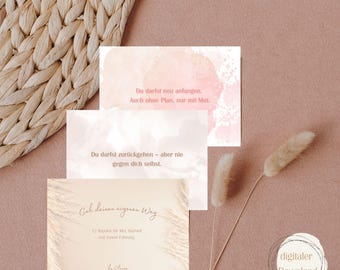 May include: Three affirmation cards with inspirational quotes in German, set against a soft pink background. The cards feature watercolor-style accents and text, with the words "Affirmations-Karten" at the top. A digital download icon is in the bottom right.
