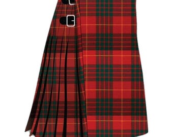 May include: A red and green plaid kilt with a pleated design. The kilt features black leather straps with silver buckles. The traditional Scottish garment is made of a woven fabric.
