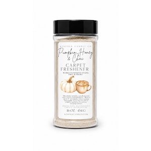 May include: A clear plastic bottle with a black cap containing carpet freshener. The label reads Kinfolk Candle Co, Pumpkin, Honey & Chai, Carpet Freshener, Works to remove stains, dirt & odors, 16 oz / 454 g, and includes a pumpkin and mug illustration.