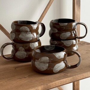 thumbnail image 2 of Mootilda American Handmade Stoneware Pottery Cow Mug 14 Oz Black Version 2 of 9