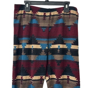 May include: Red, blue, black, and beige patterned leggings with a geometric design.
