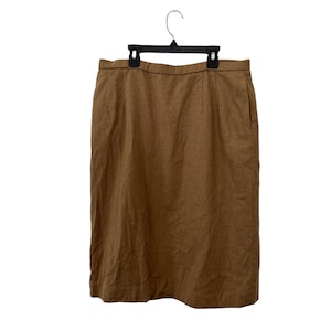 May include: A brown linen skirt with a straight silhouette and a simple design.