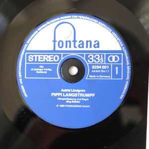 May include: A black vinyl record with a blue and white label featuring the text "fontana" and "PIPPI LANGSTRUMPF". The record is a 33 1/3 RPM stereo recording, made in Germany.