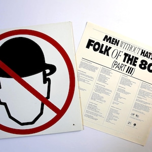 Op de afbeelding: Een vinylplatenhoes en binnenhoes voor Men Without Hats Folk of the 80's (Part III). De hoes toont een zwart silhouet van een persoon met een bolhoed in een rode verbodscirkel. De binnenhoes bevat in het zwart gedrukte tekst.