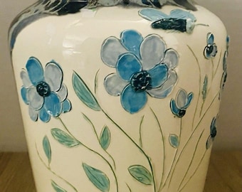 handcrafted ceramic Raised blue floral patterns textured, drip-glaze effect