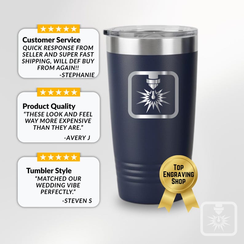 May include: A navy blue insulated tumbler with a silver lid and a laser engraving design. The design features a laser cutter and a burst of light. The tumbler has text that says "Top Engraving Shop".