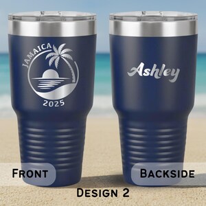 May include: Navy blue insulated travel mug with a silver rim and lid. The front displays "Jamaica", a palm tree, sun, and "2025". The back has the name "Ashley". The bottom reads "FRONT", "BACKSIDE", and "DESIGN 2".