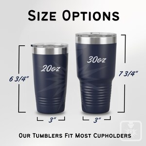 May include: Two navy blue insulated tumblers with silver rims are displayed, labeled 20oz and 30oz. The 20oz tumbler is 17.1 cm tall, and the 30oz tumbler is 19.7 cm tall. Both are 7.6 cm wide. Text at the bottom reads, "OUR TUMBLERS FIT MOST CUPHOLDERS."