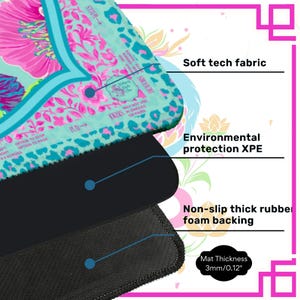 May include: A layered mousepad with a floral design in pink, teal, and white. The top layer is soft tech fabric, followed by environmental protection XPE, and a non-slip thick rubber foam backing. The mat thickness is 0.12 inches.