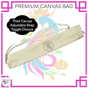 May include: Cream-colored canvas bag with an adjustable strap and toggle closure. The bag features the text "Premium Canvas Bag" and "Thick Canvas, Adjustable Strap, Toggle Closure". A floral logo is visible on the bag.