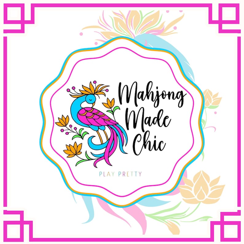 May include: A white background with a pink and gold border surrounds a central design. The design features a stylized bird in blue, pink, and orange, with the text "Mahjong Made Chic" and "Play Pretty".