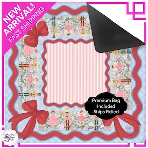 May include: A square mat featuring a central light pink and white striped square bordered by a wavy red line. The border displays a repeating pattern of nutcrackers, ballerinas, and Christmas trees on a light blue background with large red bows.